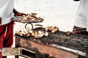 Black Man Grilling Seafood