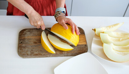 Woman Slicing Melon Into Pieces