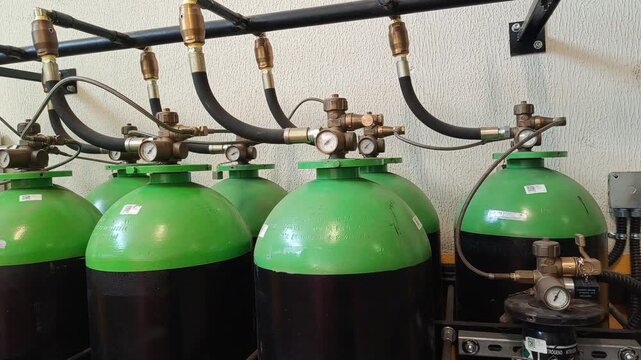 Automatic gas fire suppression system with pressurized cylinders and gauges