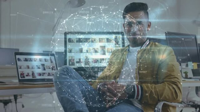 Man straightening and smiling as digital network globe intensifying visualizes creative thumbnails