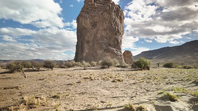 Wide timelapse shot slowly discovering the colosal figure of the Piedra Parada rock formation in Chubut, Patagonia, Argentina