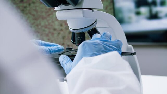 Engineer doctor working with microscope in laboratory, Scientific laboratory with various research equipment, man conducting experiments and research, Science and technology concept.