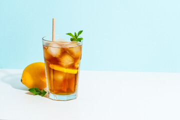 Summer cold drink on colored background with hard shadows.