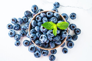 Blueberries in the bowl on white.