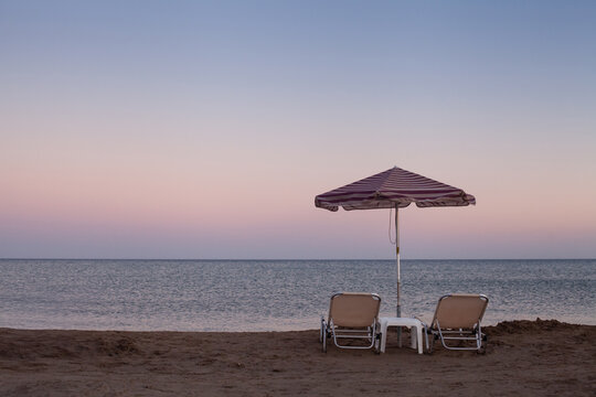 summer beach after sunset, Mediterranean sea in Greece
