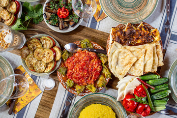 Table set with Eastern European cuisine, sarmale mamaliga placinta mici zeama, traditional Romania...