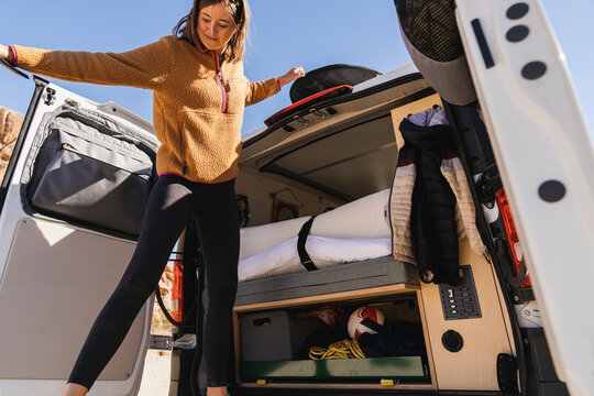 Woman in the back of her camper van