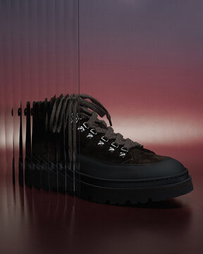 Stylish hiking boot with modern design on gradient backdrop