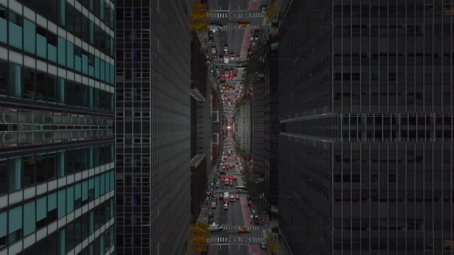 Kaleidoscopic inverted aerial point of view of New York City's skyscrapers, creating abstract and surreal cityscape with mirror effect on street traffic