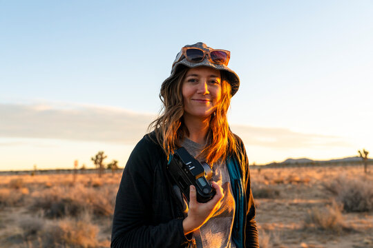 portrait traveler holding camera
