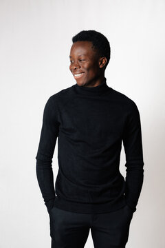 Young man smiling and looking to the side
