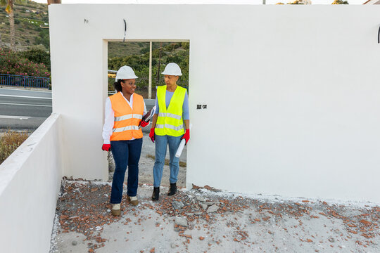 two fellow architects on a construction site