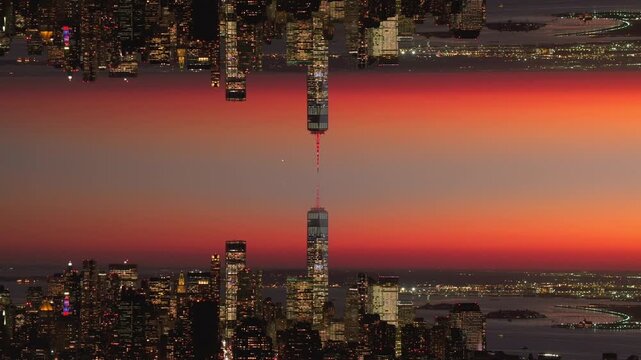 Kaleidoscopic aerial mirror effect of New York City skyline at sunset revealing surreal and abstract urban cityscape with glowing skyscrapers and One World Trade Center