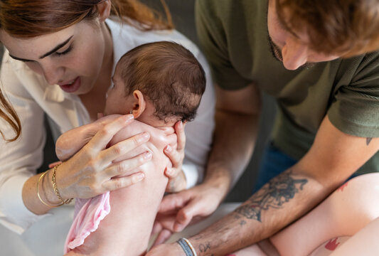 A couple preparing their baby after a bath