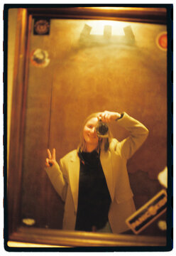 Woman making self portrait in toilet