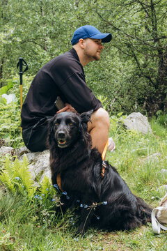 Family enjoys nature with their dog during summer trip in the woods