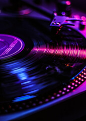 a close up of a vinyl record player with purple and blue lights close up detail view natural lightin