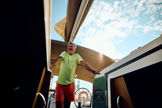 Smiling man on a sailboat