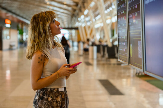 woman at the airport waiting for her flight