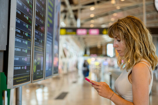 woman at the airport waiting for her flight