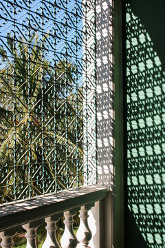 Corner detail of beautiful metal screen in window with Shadow