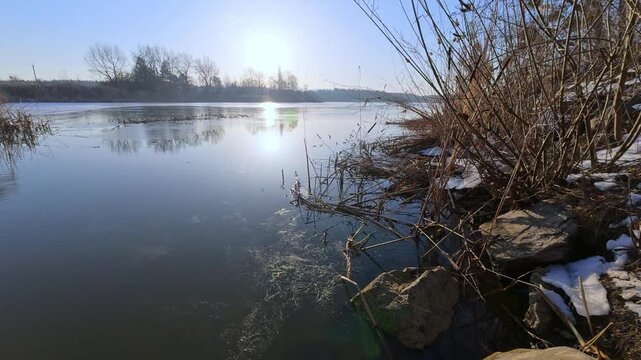 Sunny Winter Morning by the Partially Frozen Lake