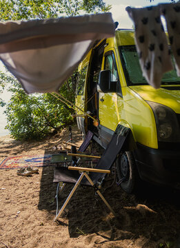 Camping Setup by the Lake With Camper Van and Outdoor Attribute