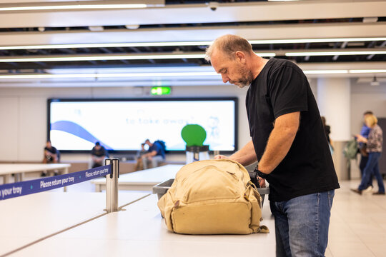 a man at a baggage checkpoint