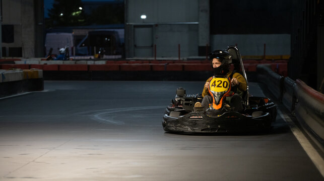 One driver speeding up in an electric-powered kart