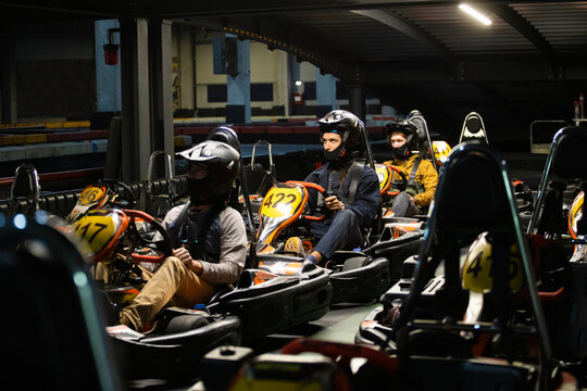 Friends on a kart racing, ready for the start
