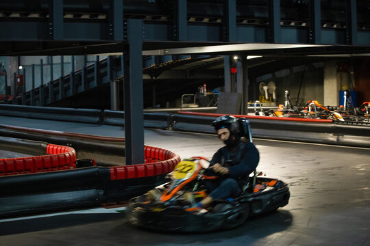 One driver speeding up in an electric-powered kart