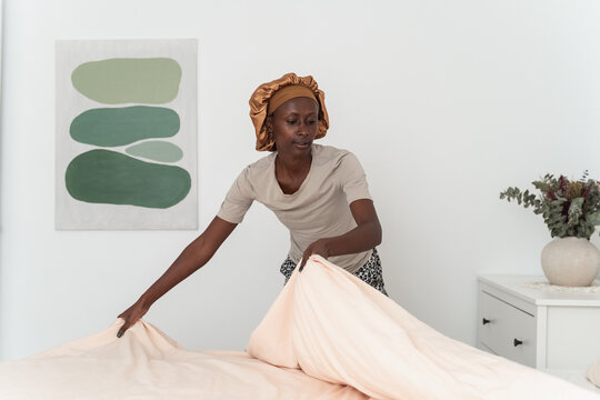 Woman making bed