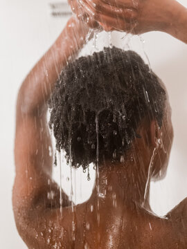 Woman enjoying hot shower 