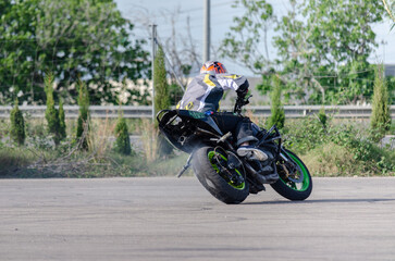 Motorcycle Rider Doing a Drift Spin &ndash; Smoke and Adrenaline