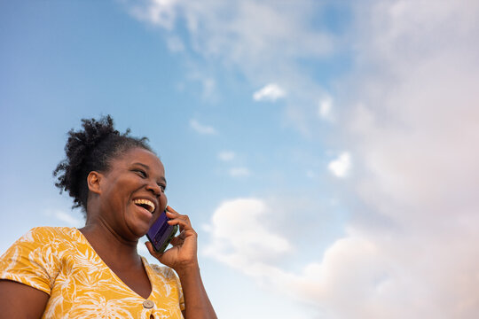 A curvy woman using her mobile phone
