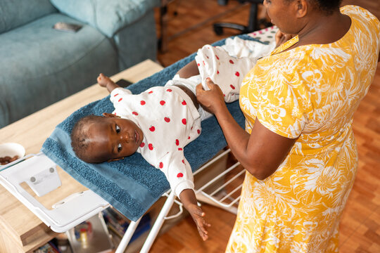a woman changing diapers