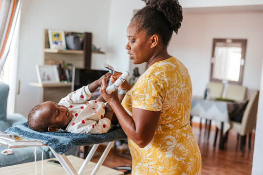 a woman changing diapers