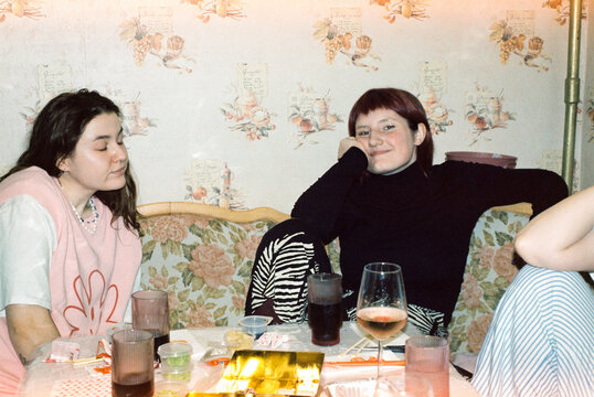 Friends hanging out at home with tea and snacks  