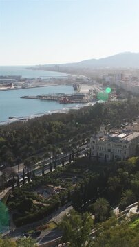 Malaga town hall and harbor from Gibralfaro lookout, Spain. 4K Vertical