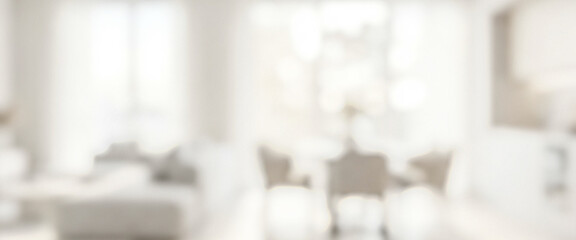The image features a blurred interior space with soft colors and minimalistic furniture. Natural light floods the area, creating a serene atmosphere in the setting.