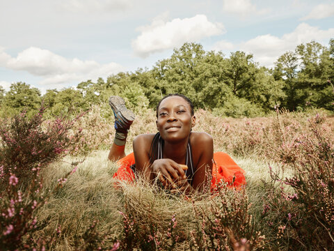 Black Woman Hiking in Red Fleece in Autumn Field