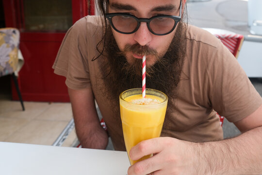 Man Drinking Mango Lassi
