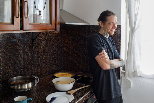 Smiling man at the stove