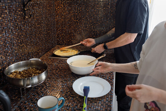 Couple makes pancakes