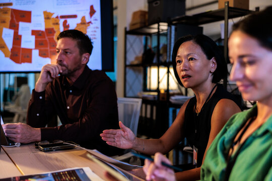 Team analyzes data during a meeting.