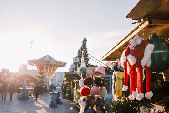 Market Stall Displays Holiday Items at Sunset in City Square