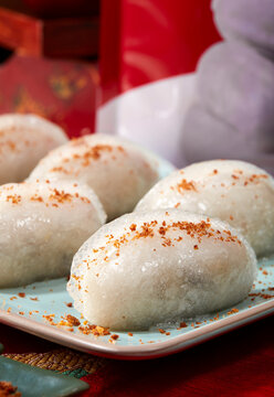 Closeup of fresh glutinous rice and meat filling wrapped on the table