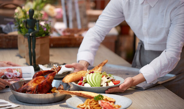 Freshly served delicious food on a wooden table