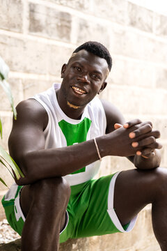 Smiling young man in sports jersey in Senegal