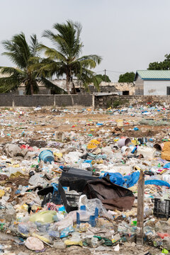 Urban landfill showing plastic waste and environmental pollution